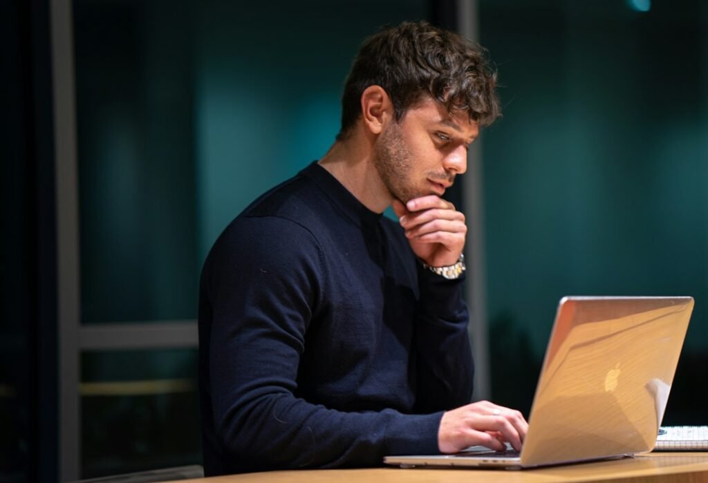 Person asking an AI assistant a question on a laptop