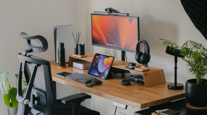 Desktop computer on a wooden desk in a home office